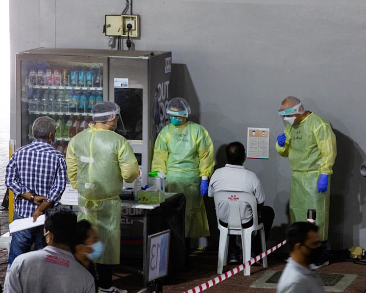 13,000 foreign workers barred from returning to work after missing deadline for Covid-19 testing