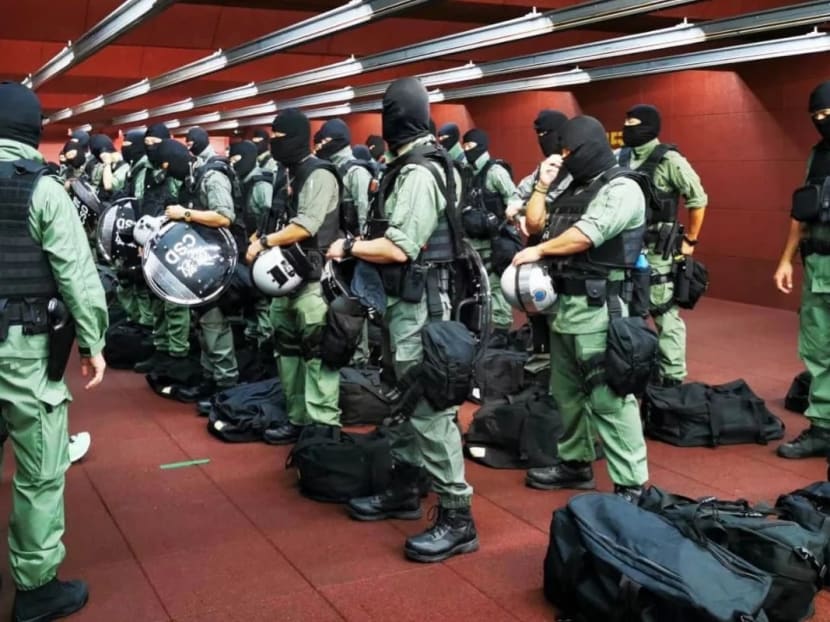 Officers from the Correctional Services Department suit up for their special constables duty.