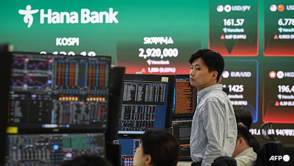 Asian stocks fluctuate after Wall Street sell-off, crude holds losses on peace talks