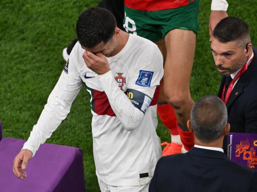 Portugal's forward Cristiano Ronaldo leaving the field in tears after losing to Morocco 1-0 in the Qatar 2022 World Cup quarter-final at the Al-Thumama Stadium in Doha on Dec 10, 2022. 