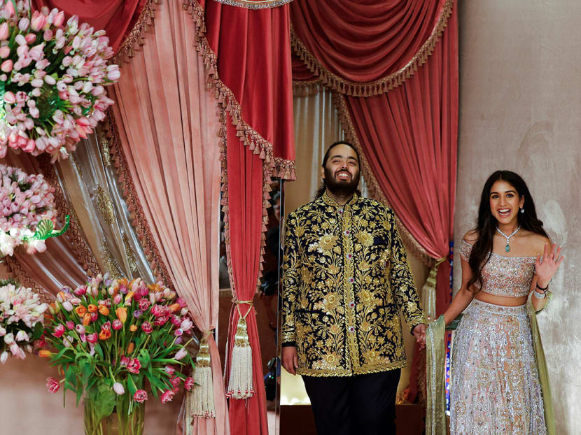Anant Ambani, son of businessman Mukesh Ambani, arrives with his fiance Radhika Merchant on the red carpet during the sangeet ceremony at Jio World Centre, Mumbai, India, July 5, 2024. Anant Ambani, son of businessman Mukesh Ambani, arrives with his fiance Radhika Merchant on the red carpet during the sangeet ceremony at Jio World Centre, Mumbai, India, July 5, 2024.