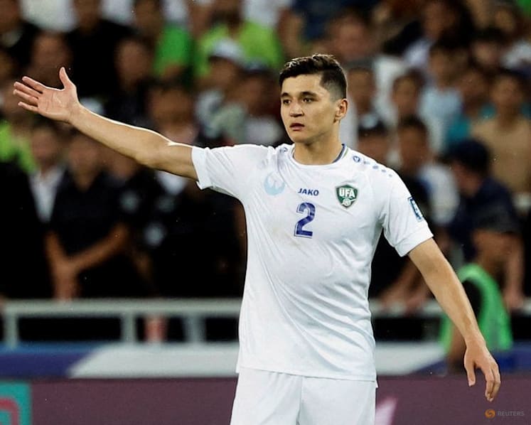 Ukbekistan's Khusanov sends apology shirt to cameraman injured in World Cup opener