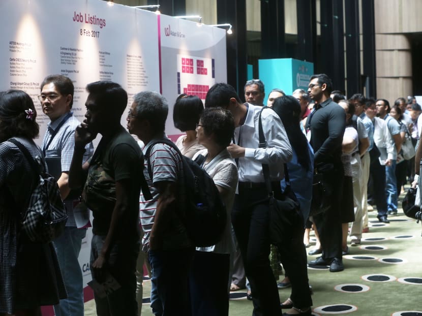 A long queue of people waiting to enter the Adapt And Grow job fair at Crowne Plaza Changi Airport, where more than 2,300 jobs at Changi Airport are looking to be filled. Photo: TODAY A long queue of people waiting to enter the Adapt And Grow job fair at Crowne Plaza Changi Airport, where more than 2,300 jobs at Changi Airport are looking to be filled. Photo: TODAY