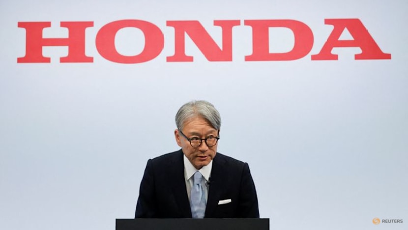 Honda CEO apologises for company's loss, wins investor backing at annual meeting