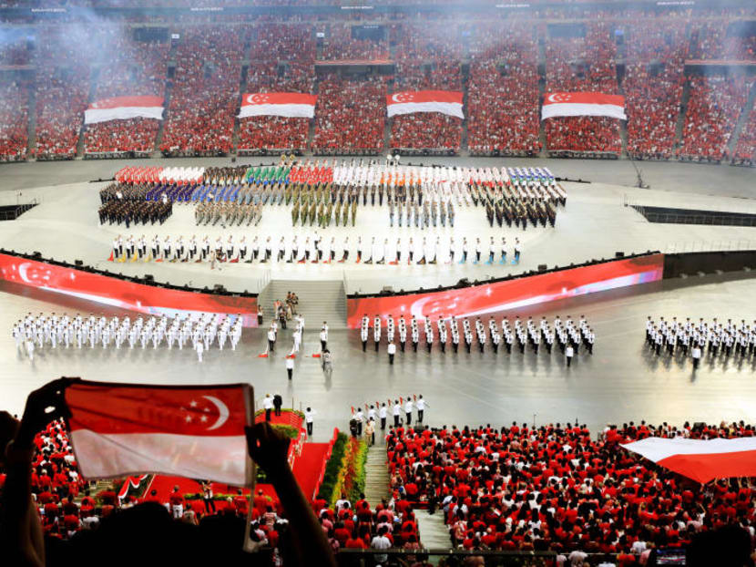 Crowds at the National Day Parade may have pledged to be "as one united people, regardless of race, language or religion"; but a survey showed that many feel racism is still a problem here . Photo: Koh Mui Fong.