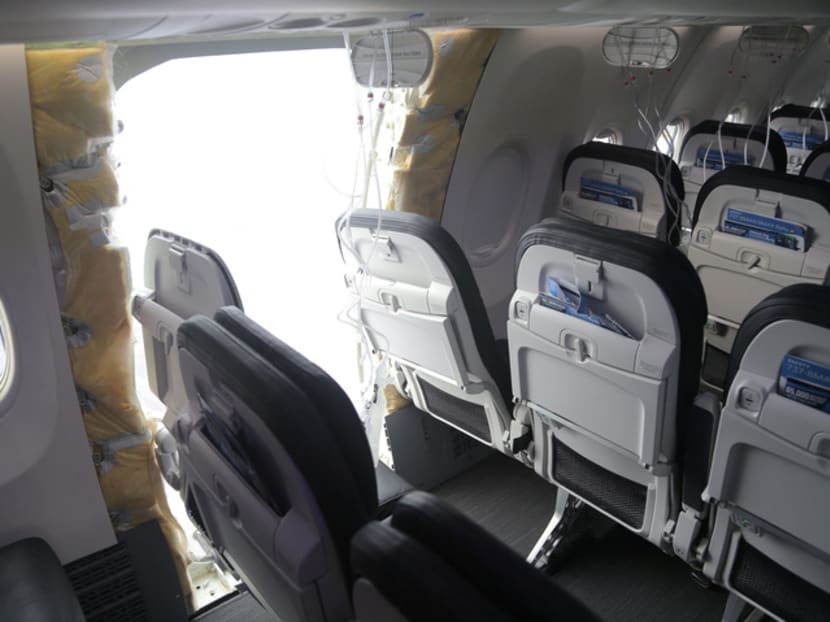 The fuselage plug area of Alaska Airlines Flight 1282 Boeing 737 MAX 9, which was forced to make an emergency landing with a gap in the fuselage, is seen during its investigation by the National Transportation Safety Board (NTSB) in Portland, Oregon, in the United States on Jan 7, 2024. 