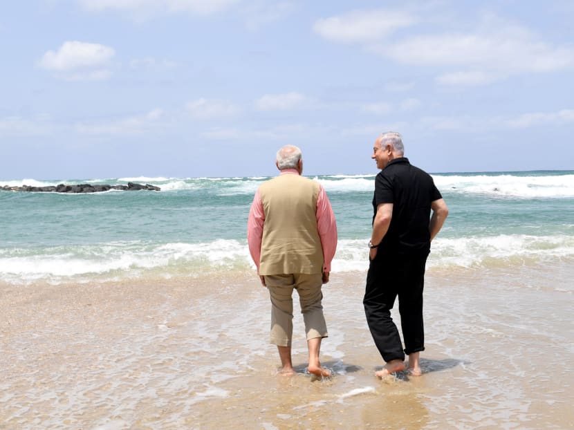 Israel's Prime Minister Benjamin Netanyahu (R) walks with India's Prime Minister Narendra Modi, as they visit Olga Beach and a water desalination unit operated by G.A.L. Water Technologies, near Hadera, Israel July 6, 2017. Photo: Kobi Gideon/Courtesy of Government Press Office/GPO/Handout via Reuters