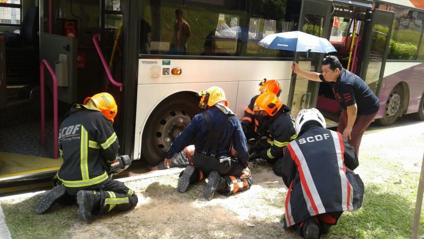 Hougang accident leaves man trapped under bus