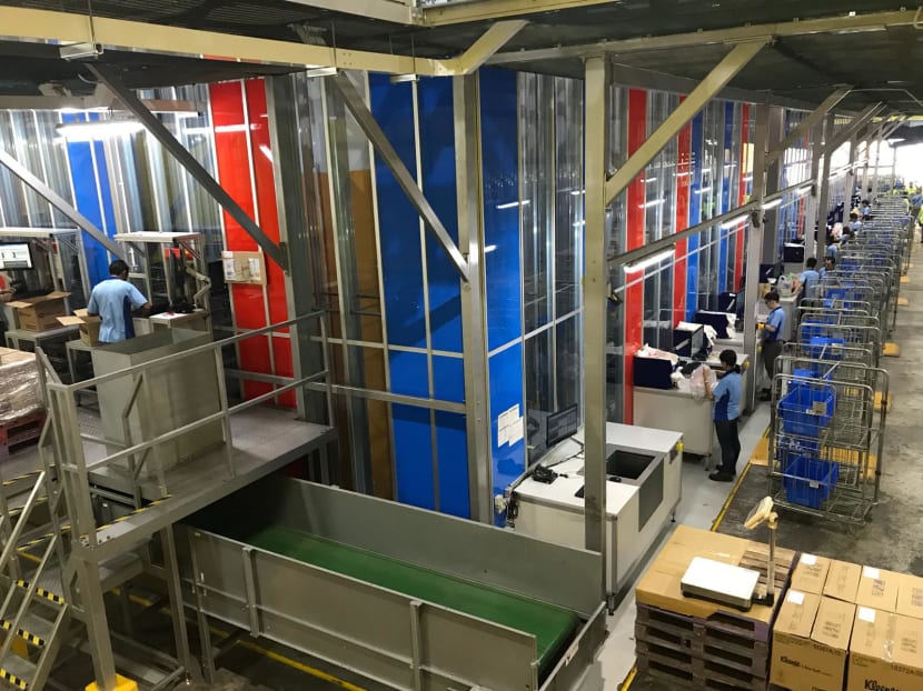 Acting like a “huge vending machine” that is able to automatically store, retrieve and dispense thousands of products, NTUC FairPrice says the AutoStore will change how customers’ deliveries are done. Photo: Toh Ee Ming/TODAY