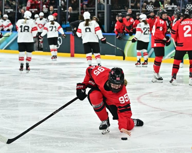 Ice hockey-Canada look to captain Poulin in title defence after goal-scoring record