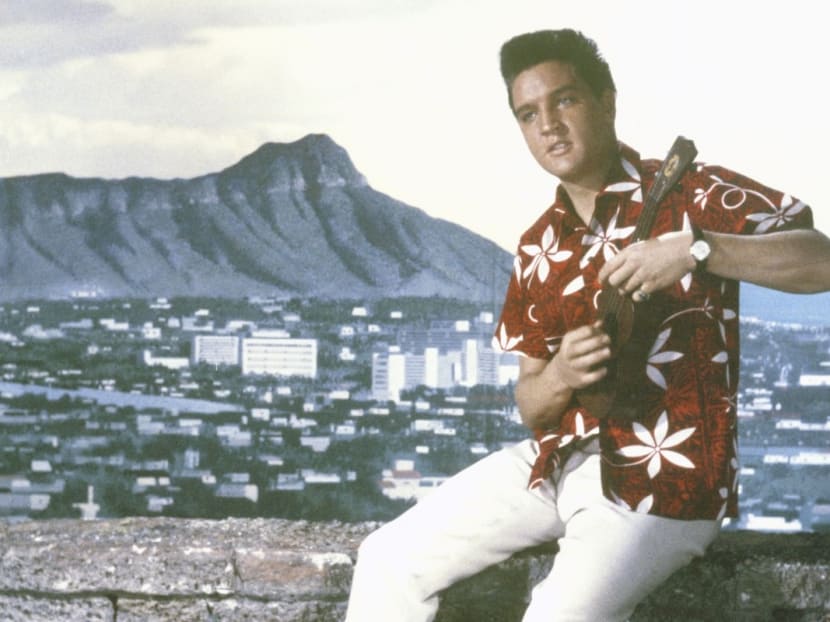 Elvis Presley wearing a Hawaiian shirt in the 1961 film Blue Hawaii, one of many actors to have sported the garment on screen. Chinese-American Ellery J. Chun was the first person in Hawaii to mass-produce the shirts after registering the trade name Aloha shirt. Elvis Presley wearing a Hawaiian shirt in the 1961 film Blue Hawaii, one of many actors to have sported the garment on screen. Chinese-American Ellery J. Chun was the first person in Hawaii to mass-produce the shirts after registering the trade name Aloha shirt.