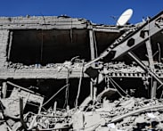 Under airstrikes, Iran defiant on eve of Trump's ceasefire deadline  