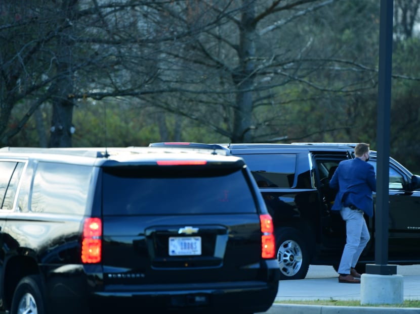 A Secret Service agent aids the arrival of President-elect Joe Biden at Delaware Orthopaedic Specialists on Nov 29, 2020 in Newark, Delaware.