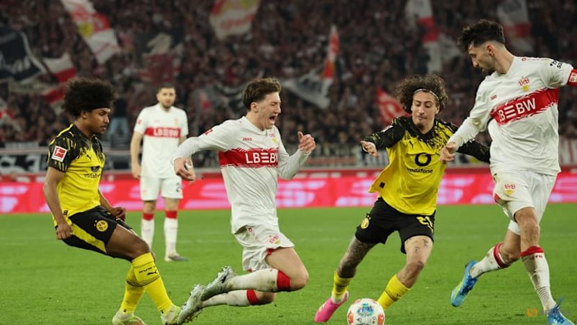 Dortmund score twice in stoppage time to beat Stuttgart 2-0