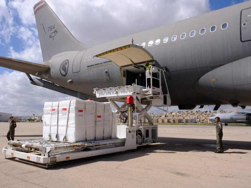 Singapore's humanitarian supplies being unloaded from the RSAF's Multi-Role Tanker Transport in Amman, Jordan.