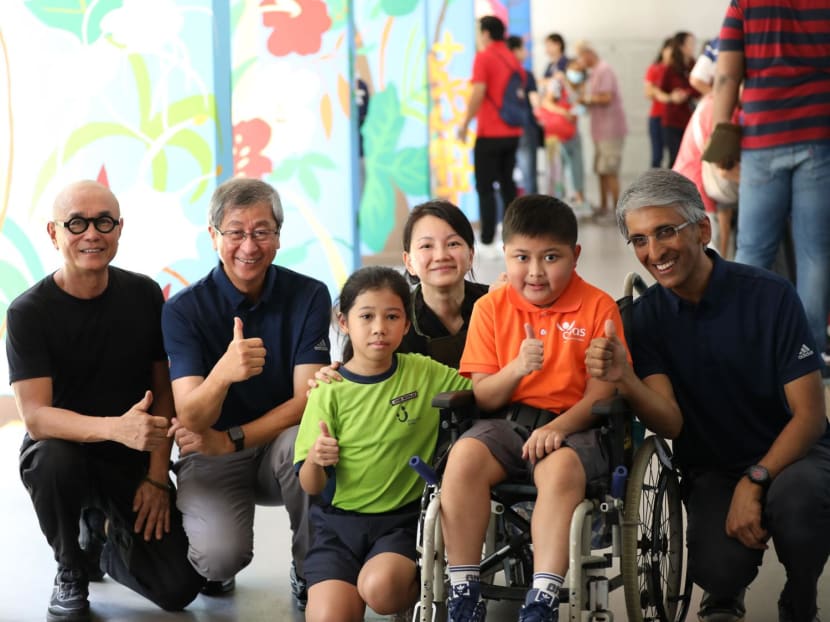 Mr Lim Boon Heng, chairman of Temasek Holdings (second from left), and Mr Dilhan Pillay, executive director and chief executive officer of Temasek Holdings (right), at the void deck of Block 344 Clementi Avenue 5. They are photographed on June 25, 2024 with people involved in an artwork helping to mark Temasek's 50th anniversary. Mr Lim Boon Heng, chairman of Temasek Holdings (second from left), and Mr Dilhan Pillay, executive director and chief executive officer of Temasek Holdings (right), at the void deck of Block 344 Clementi Avenue 5. They are photographed on June 25, 2024 with people involved in an artwork helping to mark Temasek's 50th anniversary.