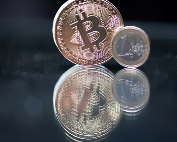 Commentary: Greater acceptance of cryptocurrency for payments likely in 2022