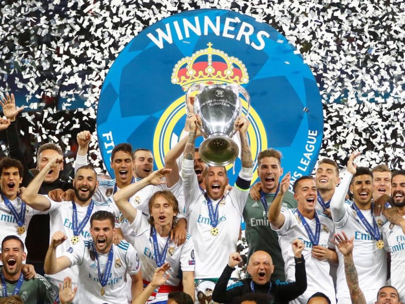 Real Madrid's Sergio Ramos lifts the trophy as they celebrate winning the Champions League for the 2017-2018 season.
