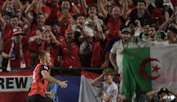 Austria draw with Algeria in World Cup thriller to progress and send Iran home
