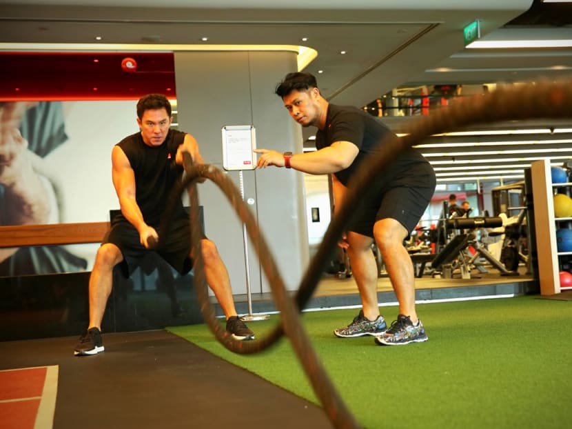 Television host Dominic Lau said his trainer, Yasir Harun of Pure Fitness Asia Square, is a no-nonsense guy. Photo: Nuria Ling