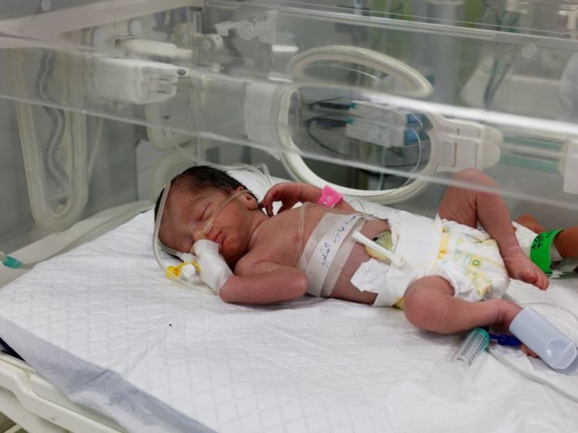 A Palestinian baby girl, saved from the womb of her mother Sabreen Al-Sheikh (Al-Sakani), who was killed in an Israeli strike along with her husband Shokri and her daughter Malak, lies in an incubator at Al-Emirati hospital in Rafah in the southern Gaza Strip on April 21, 2024.
