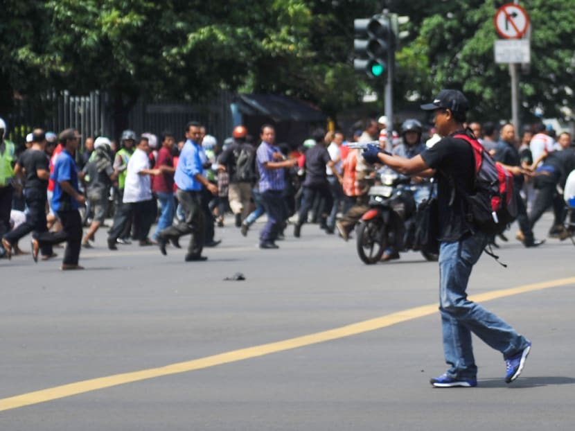 Seven dead in Jakarta blasts, gunfight