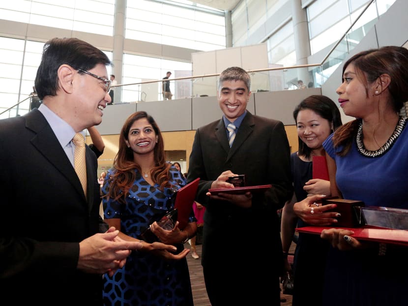(From left) Education Minister Heng Swee Keat with OYEA winners Premlatha Selvaraj, Hazelman Norhafis, Winnie Tan and Priyadakshini Surendiran S today. Photo: Jason Quah/TODAY