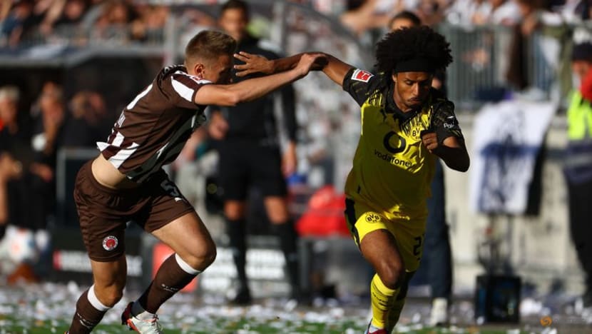 Dortmund concede two late goals to draw 3-3 at St Pauli in Bundesliga opener Dortmund concede two late goals to draw 3-3 at St Pauli in Bundesliga opener