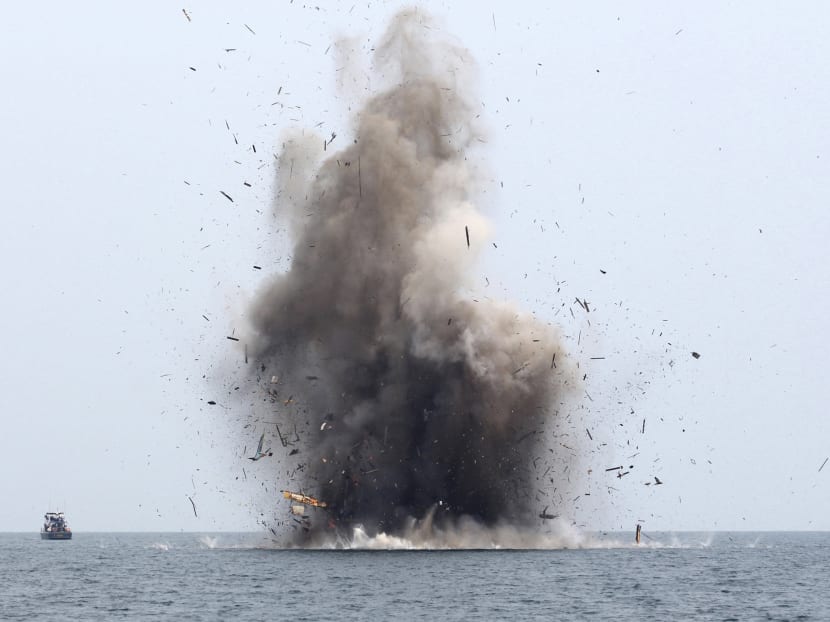 Three Malaysian fishing boats are destroyed for illegal fishing, by the Ministry of Maritime Affairs and Fisheries along with the police and navy, near Langsa, Aceh province, Indonesia. Photo: Reuters Three Malaysian fishing boats are destroyed for illegal fishing, by the Ministry of Maritime Affairs and Fisheries along with the police and navy, near Langsa, Aceh province, Indonesia. Photo: Reuters