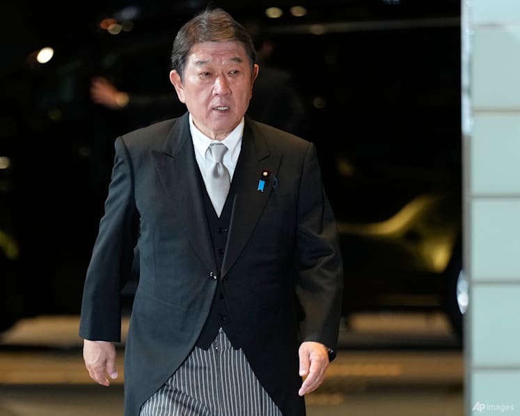 Japan says it plans to tell Trump it will build up military, upgrade security strategy