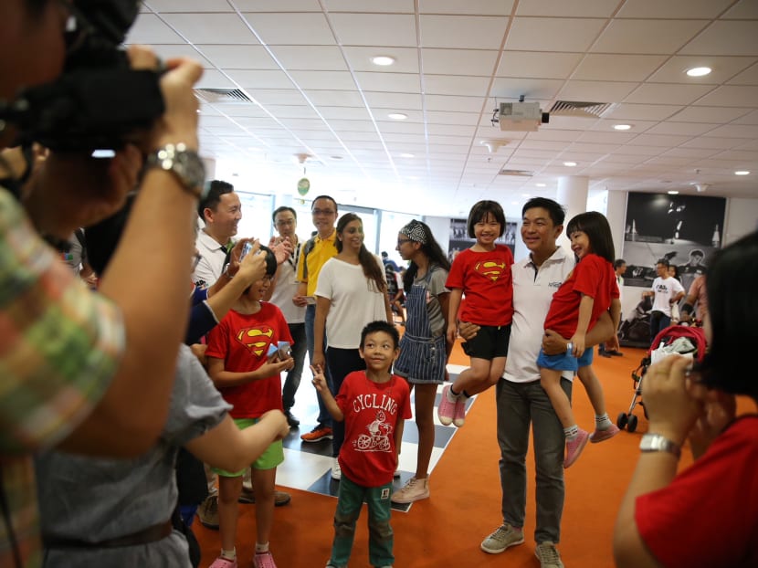 Speaker of Parliament Tan Chuan-Jin posing with children attending the Dads’ Day Out carnival at the Singapore Sports Hub's OCBC Square on Sunday (June 17). Speaker of Parliament Tan Chuan-Jin posing with children attending the Dads’ Day Out carnival at the Singapore Sports Hub's OCBC Square on Sunday (June 17).