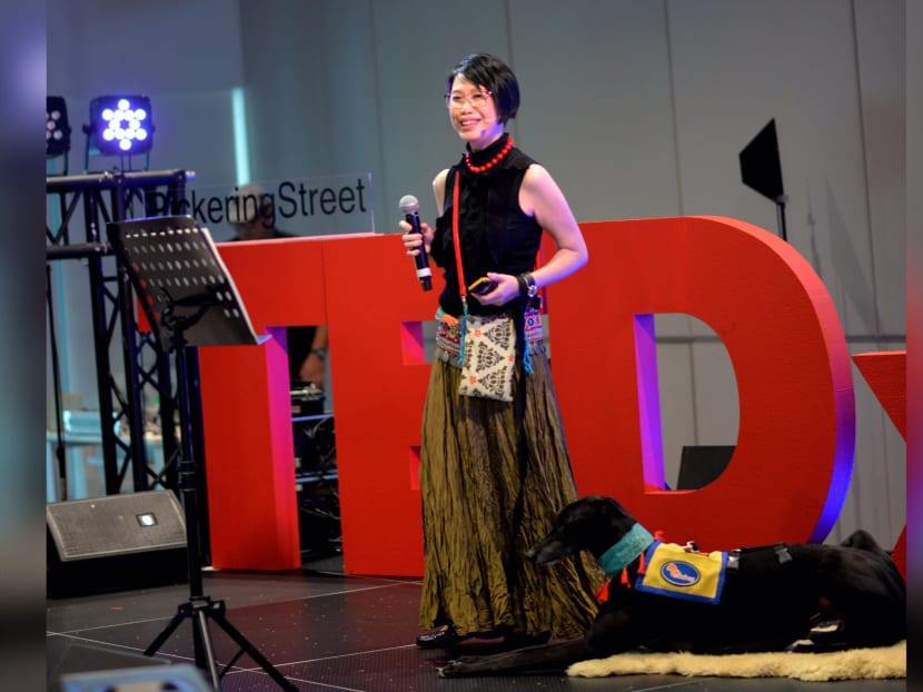 The author, seen here with her sensory anxiety assistance dog, at a talk in 2018.