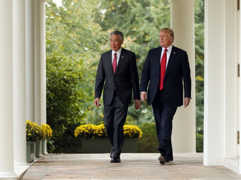 President Donald Trump, accompanied by Singapore's Prime Minister Lee Hsien, arrives at a news conference in the Rose Garden at the White House, Monday, Oct. 23, 2017 in Washington. Photo: AP
