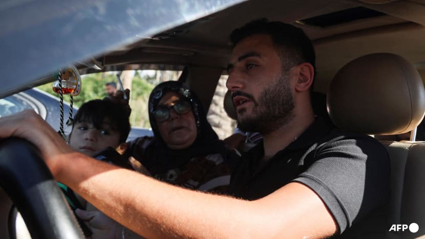 Terrified Lebanese families flee massive Israeli bombardment Terrified Lebanese families flee massive Israeli bombardment