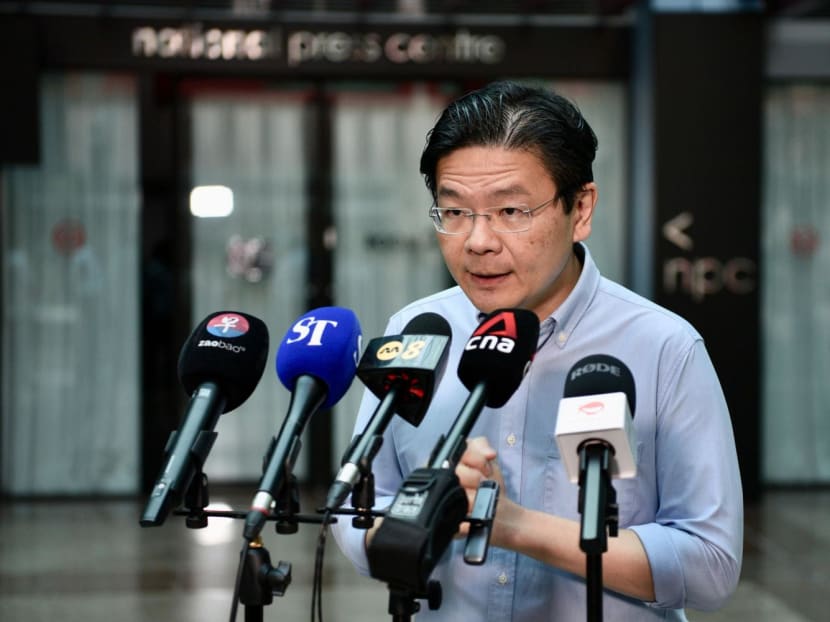 Deputy Prime Minister Lawrence Wong speaking to reporters on July 12, 2023. 