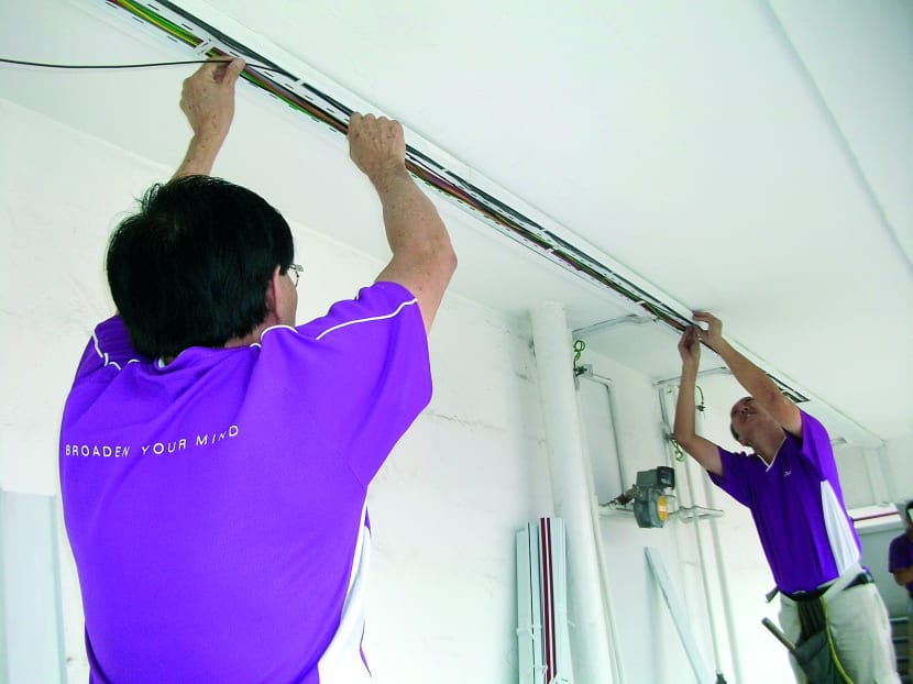 OpenNet (now known as NetLink Trust) optical fibre point installation. TODAY file photo