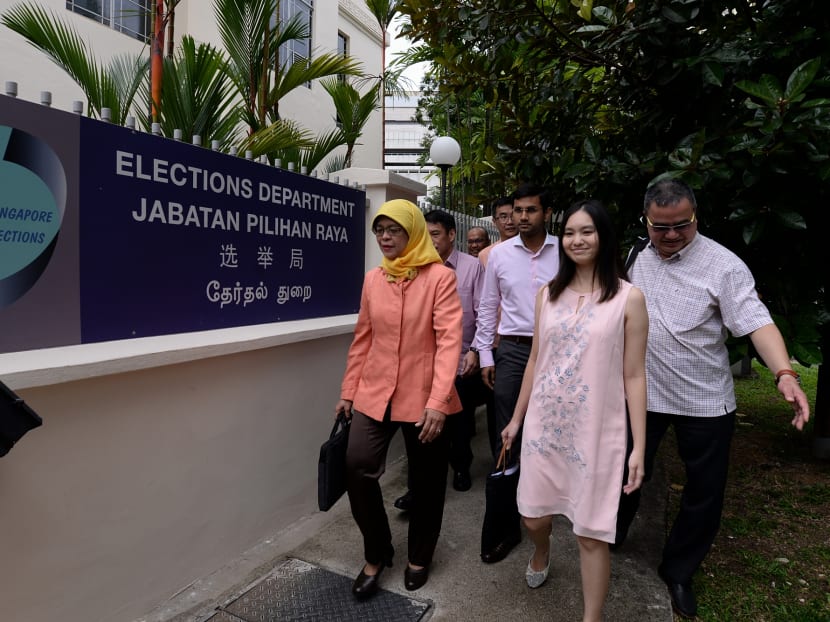 Presidential hopeful Halimah Yacob (left) and members of her campaign team arriving at the Elections Department, on August 30, 2017. Photo: Robin Choo/TODAY