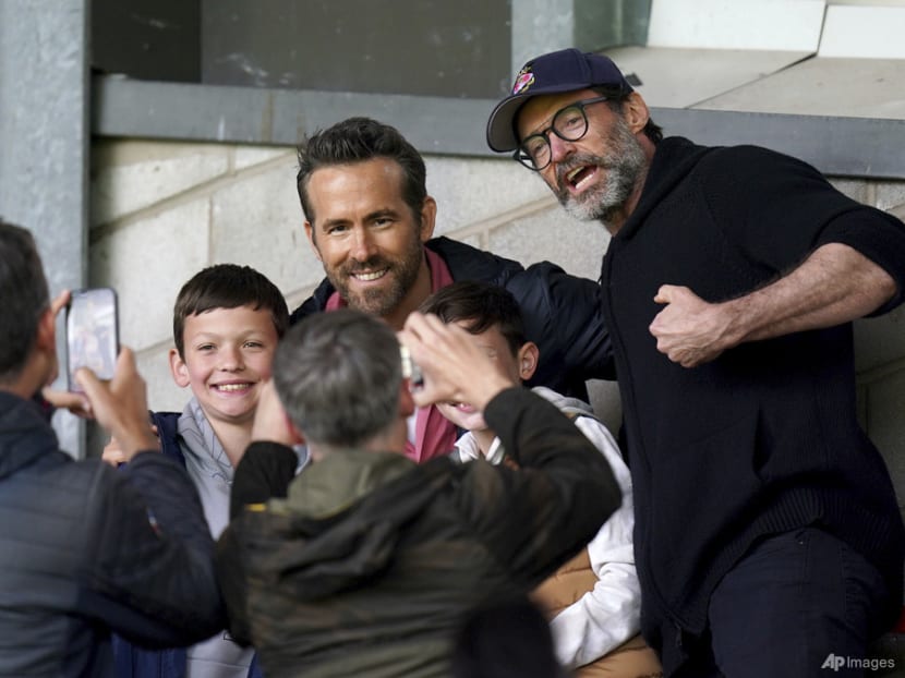 Wrexham co-owners Ryan Reynolds and Rob McElhenney take Hugh Jackman to soccer match