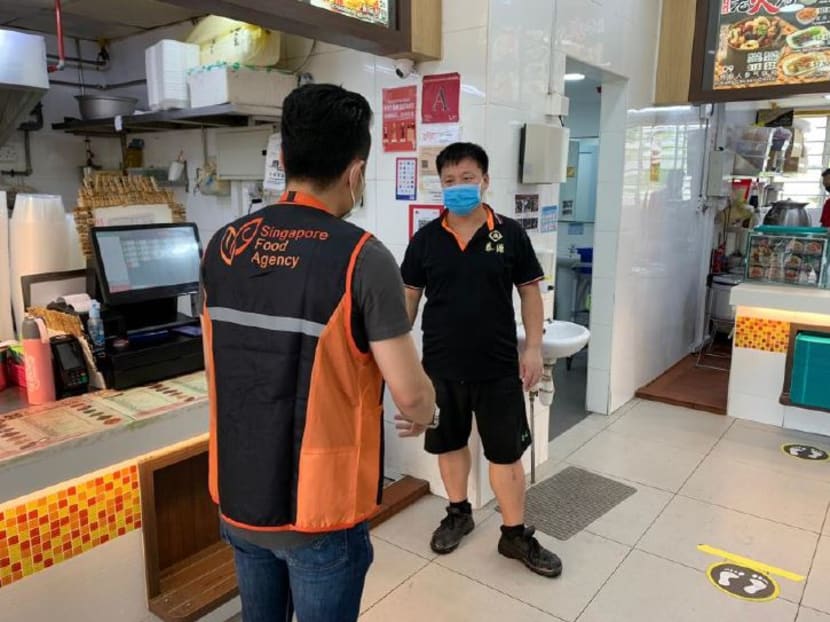 An enforcement officer doing an inspection at a coffee shop in Bedok North. Mr Masagos Zulkifli, Minister of the Environment and Water Resources, said that from April 8, 2020 onwards, the authorities will not hesitate to issue stern warnings that will lead to fines for people who still continue to gather in public. An enforcement officer doing an inspection at a coffee shop in Bedok North. Mr Masagos Zulkifli, Minister of the Environment and Water Resources, said that from April 8, 2020 onwards, the authorities will not hesitate to issue stern warnings that will lead to fines for people who still continue to gather in public.