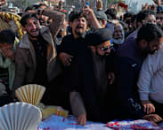 Thousands mourn victims of suicide bombing in Islamabad, as four arrests made