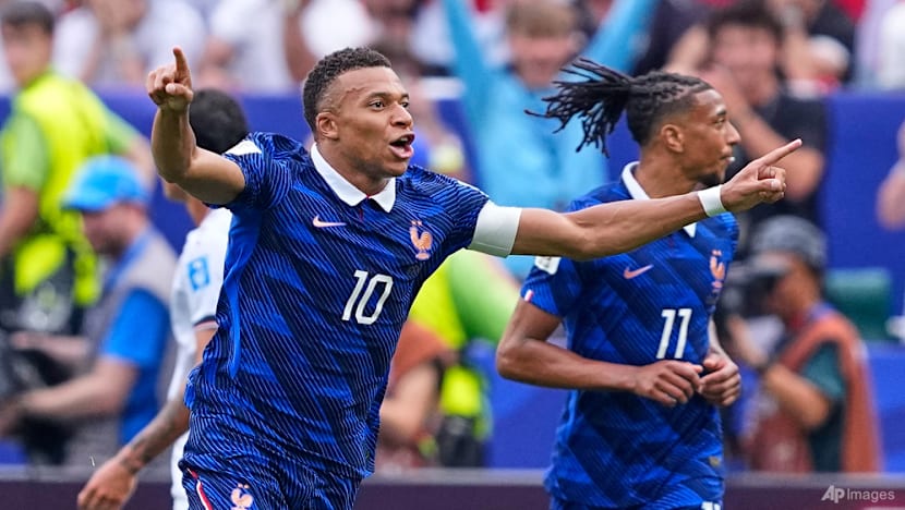 Mbappe double sends France into World Cup knockout rounds after weather delay Mbappe double sends France into World Cup knockout rounds after weather delay