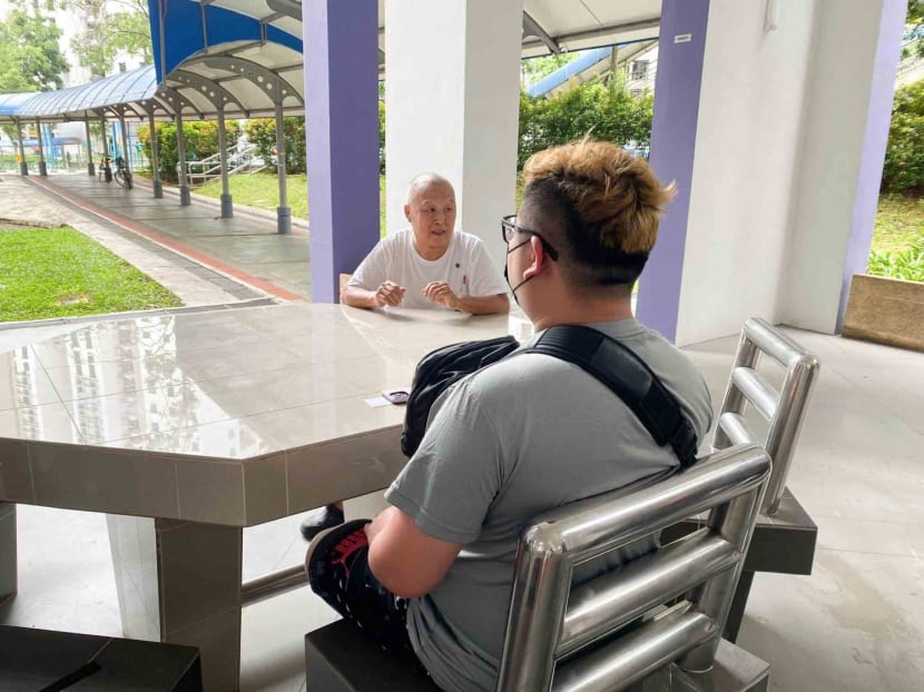 The victim’s nephew (back facing), who wanted to be known only as Mr Lee, and Mr Ng Swee Meng, brother-in-law of the deceased.