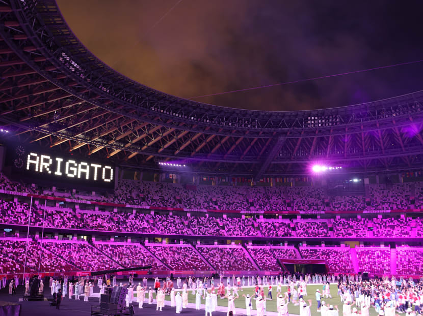 A sign "Arigato", meaning thank you in Japanese, is displayed at the end of the Tokyo 2020 Olympic Games Closing Ceremony at the Olympic Stadium in Tokyo, Japan, on Aug 8, 2021.
