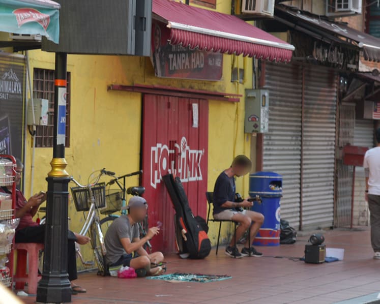 'Please help fund my trip': Begpackers linger at Melaka's Jonker Street despite ban
