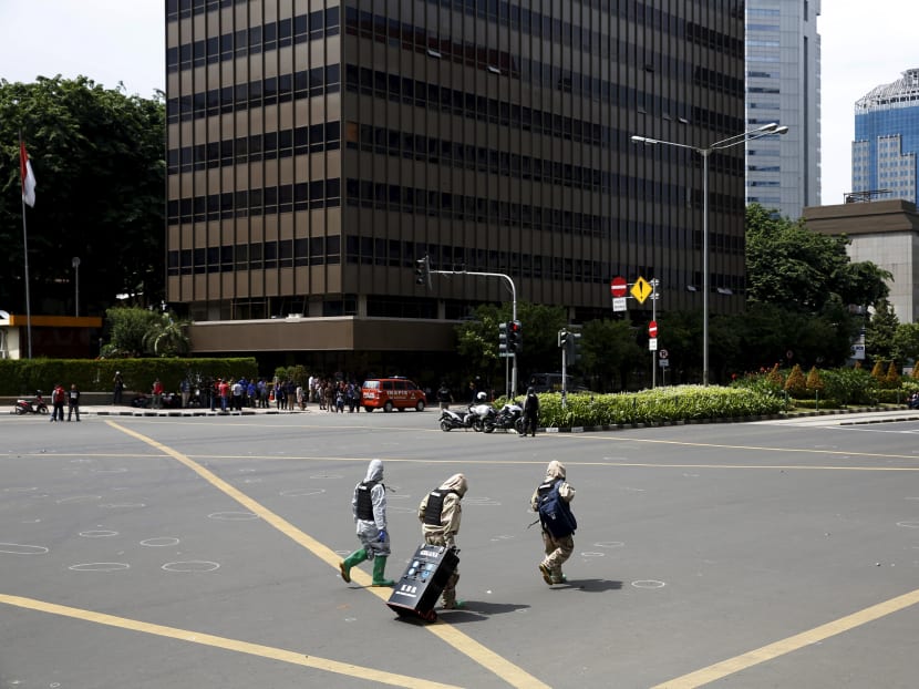 Seven dead in Jakarta blasts, gunfight