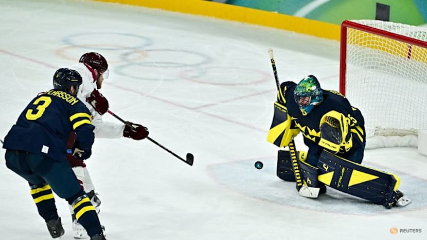 Ice hockey-Sweden beat Latvia to set men's quarter-final meeting with US