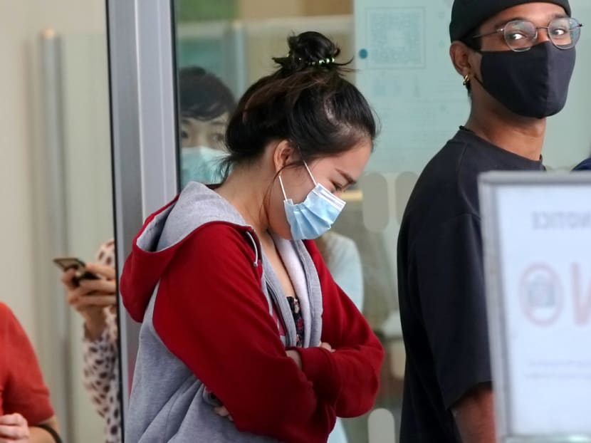 May Moe Kyi (centre) outside the State Courts on Sept 27, 2021.