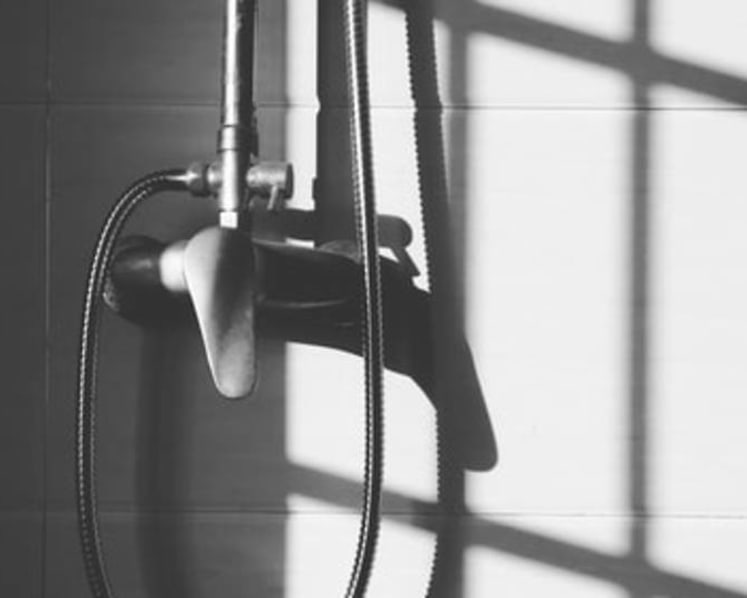 Man placed phone in toilet to film stepdaughter showering, video clip showed him positioning the phone