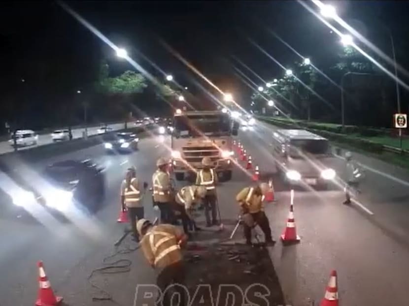 A screengrab of a video clip showing the moments just before a man (right) was hit by a lorry on the Pan Island Expressway on July 2, 2023.