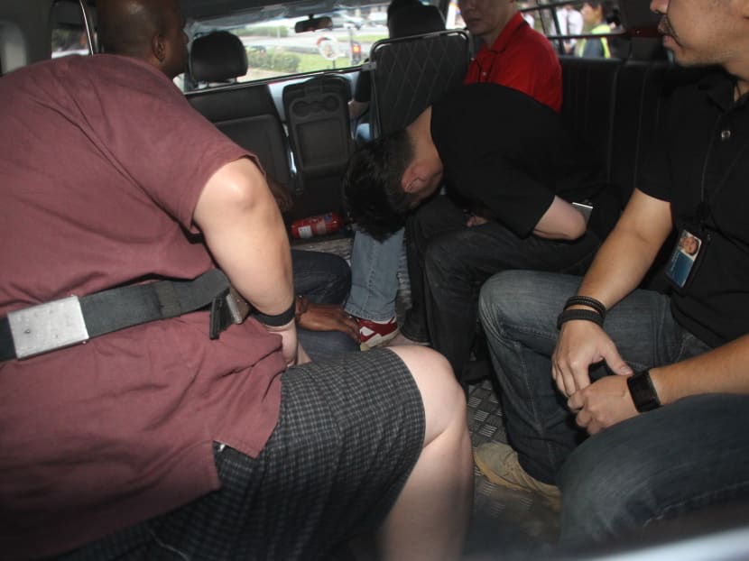 The alleged kidnappers arrving at the Subordinate Courts, Jan 10, 2014. Photo: Ooi Boon Keong